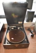 An early 20th Century wind up portable gramophone in stained wood case