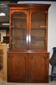 A Victorian mahogany bookcase having double cupboard under, dimensions approx. W122cm H228cm