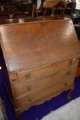 An early to mid 20th Century stained frame bureau on ball and claw feet, width approx. 76cm, quite