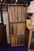 A pine bookcase containing set of Enclopaedia Britannica (11th Edition)