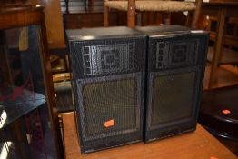 A vintage teak effect hifi cabinet and Sharp music centre