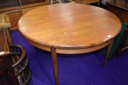 A vintage teak circular extending dining table, G Plan, diameter approx. 122cm
