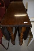 An early to mid 20th Century oak twist gate leg table of narrow proportions, approx 91 x 32cm closed