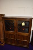 A vintage part oak bookcase with double cupboard under, width approx. 92cm, depth 32cm