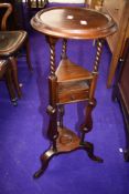 A modern reproduction hardwood plant stand