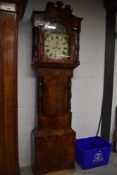 A late 19th Century flame mahogany long case clock having painted arch dial , 8 day movement,