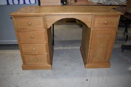 A stripped pine desk, approx. Dimensions width 122cm, depth 50cm height 76cm