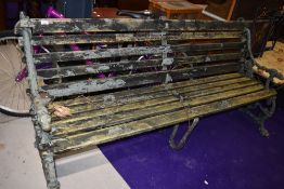 An Antique cast iron ended bench, in the Coolbrookdale style, having naturalistic design, dog