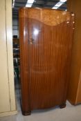 A mid 20th Century mahogany and walnut small robe, having shelves and glazed top interior