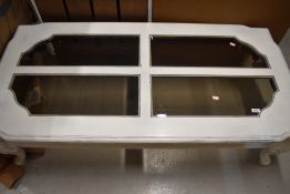 A modern painted coffee table , having smoked glass panels, approx. 137 x 67cm