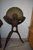 A vintage grindstone on stand