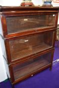 An early 20th Century stained frame stacking bookcase, three tiers, labelled Globe Wernicke