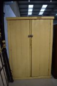 A vintage painted pine cupboard, having shelved interior, approx. dimensions W125cm H168cm D40cm