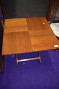 A vintage folding occasional side table