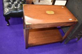 A modern mahogany campaign style occasional/coffee table