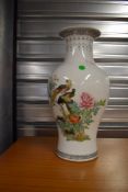 A reproduction Oriental vase, nice decorators piece, height approx. 36cm, some cracking to neck