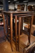 An Edwardian mahogany and inlaid nest of three tables