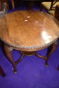 An early 20th Century mahogany low occasional table, diameter approx. 61cm