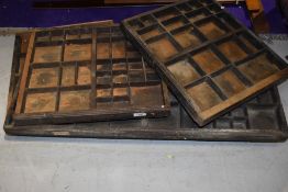 A selection of vintage printers trays