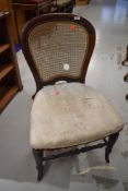 A Victorian mahogany dining chair having stuffed seat and bergere back (needs attention)
