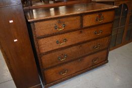 A 19th Century oak chest of two over three drawers, having later, but still period, brass drop