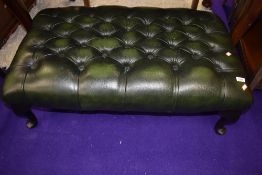 A large Green buttoned leather footstool approx. 95 x 57cm