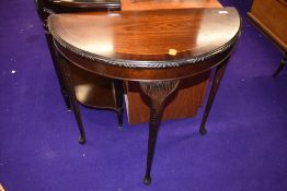 A reproduction mahogany demi lune hall table on cabriole legs, width approx. 74cm