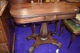 A William IV mahogany fold over tea table on column support with quadruple scroll feet, width 93cm