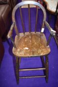 A traditional stained frame high chair