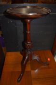 A reproduction mahogany wine table on triple splay legs, diameter approx. 25cm