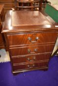 A reproduction Regency two drawer filing cabinet