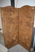 A vintage two panel room divider, having damask style hunting and foliate decoration and leather