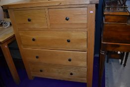 A nice quality modern oak and pine bedroom chest of two over three drawers, width approx. 100cm