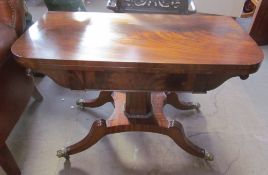 A Regency mahogany card table with a rectangular fold over top with a baize interior on a tapering