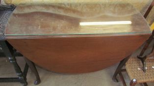 A 19th century mahogany gate leg dining table with drop flaps on cabriole legs and pointed pad