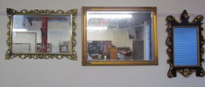 A gilt wall mirror together with a collection of modern wall mirrors