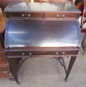 An Edwardian mahogany cylinder bureau with drawers and square legs