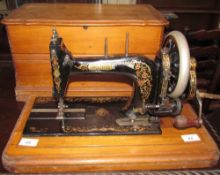 A cased Bradbury sewing machine