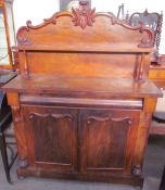 A Victorian mahogany chiffonier with a raised superstructure and shelf,