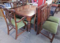 A Victorian mahogany extending dining table with rounded corners on tapering reeded legs,