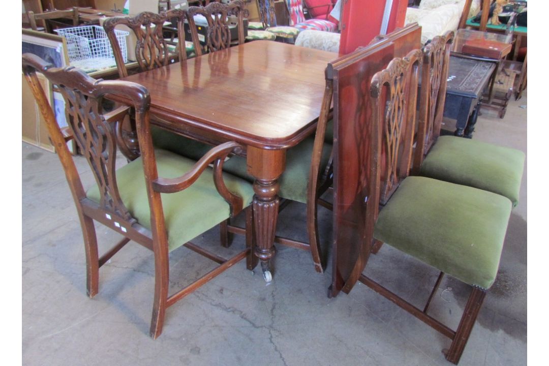 A Victorian mahogany extending dining table with rounded corners on tapering reeded legs, - Image 1 of 3