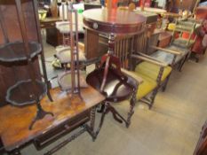 A Victorian walnut games table together with two folding cake stands,