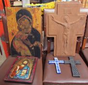 A plaster crucifix together with two other crucifixes and two icons