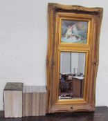 A gilt wall mirror inset with a picture of cats together with assorted folio society books