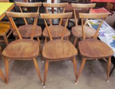 A set of six Ercol elm seated stacking dining chairs, Patent No. 845,582, Reg. Design No. 884892