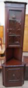 A reproduction mahogany standing corner cupboard with a glazed top and cupboard base