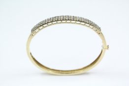 An Impressive 14ct Yellow Gold Diamond Bangle