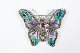 A Silver and Plique a Jour Brooch