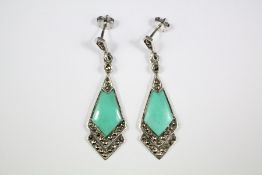 A Pair of Silver and Turquoise Earrings