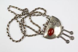 A Silver and Carnelian Pendant